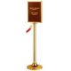 Rope barrier post with signboard, gold